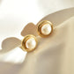 round faux pearl golden earrings with ropy border