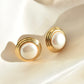 round faux pearl golden earrings