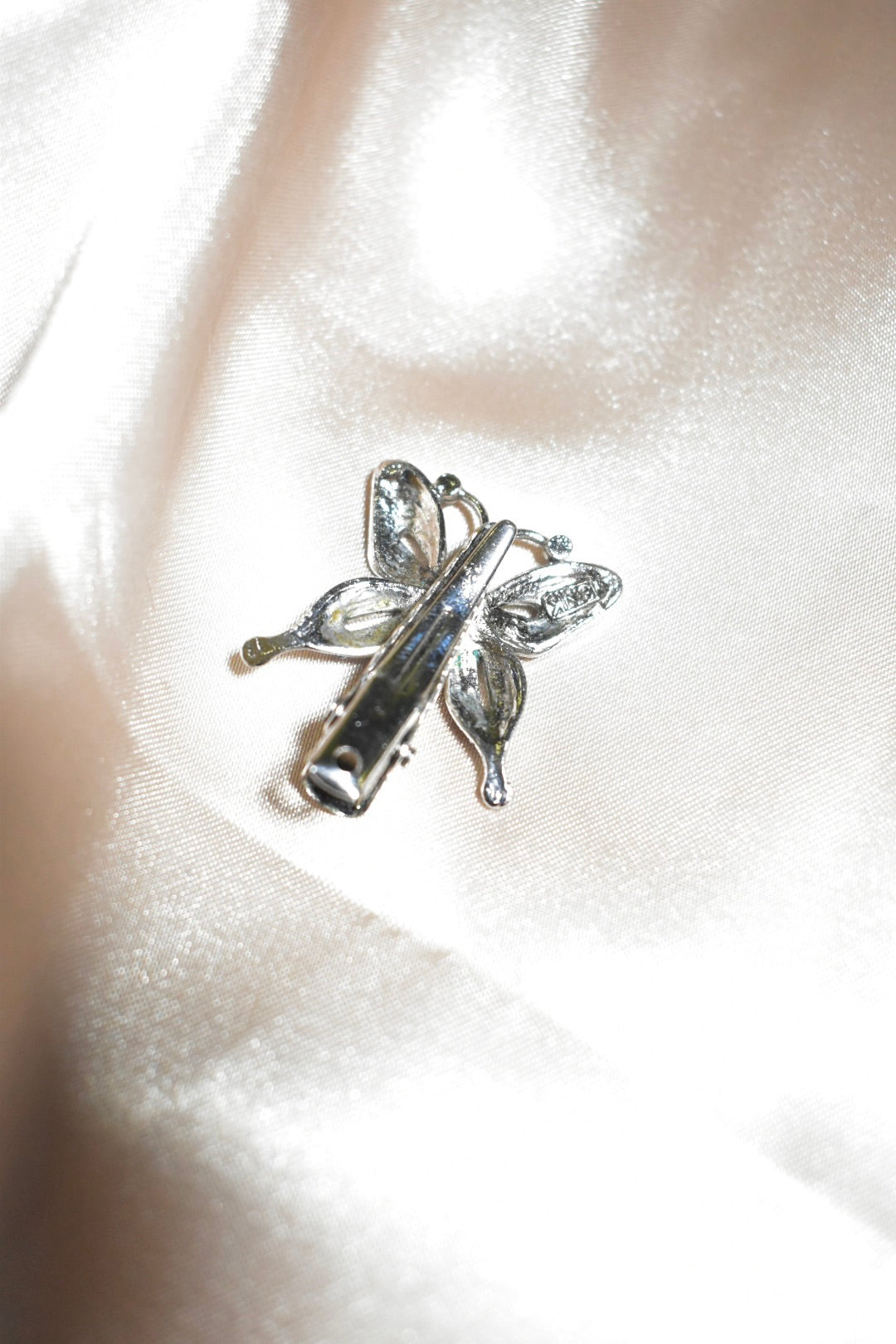 silver butterfly clip with black gems