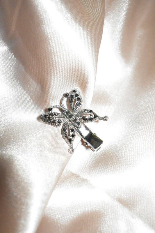silver butterfly clip with black gems